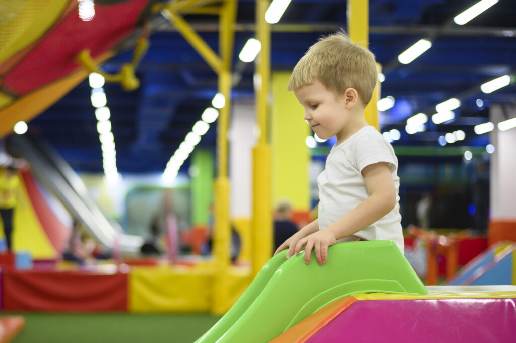 Boy playing in a soft play centre