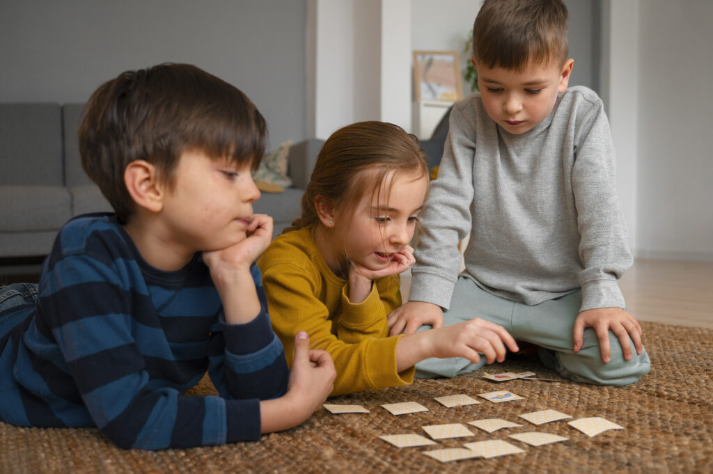 3 kids playing memory games