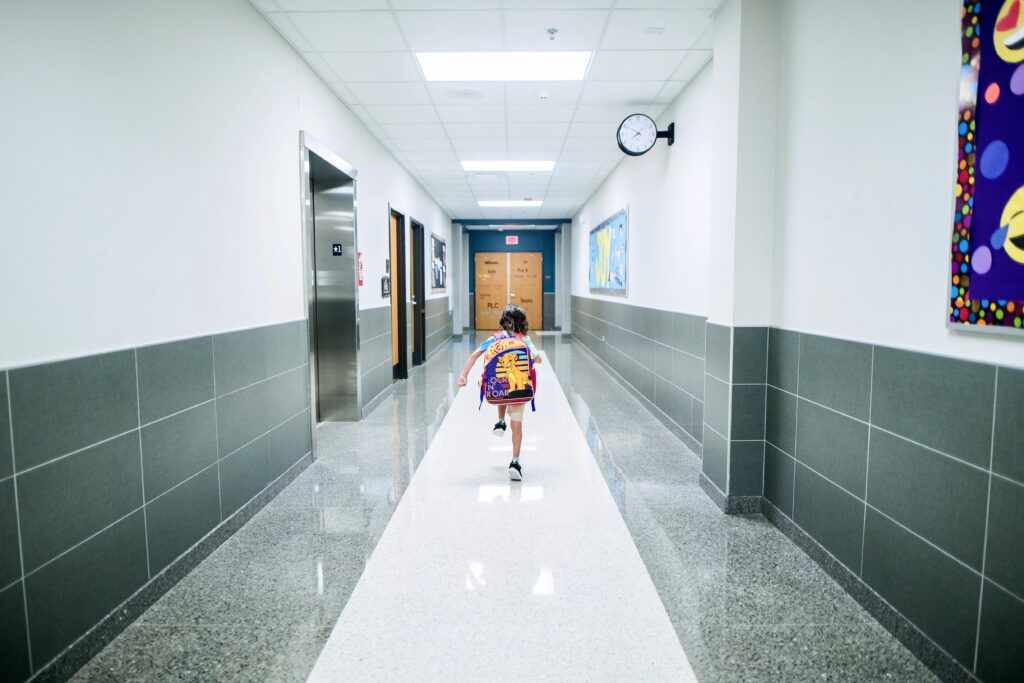 Child skipping in school hall